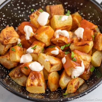 Potatoes with Bravas sauce in a bowl.