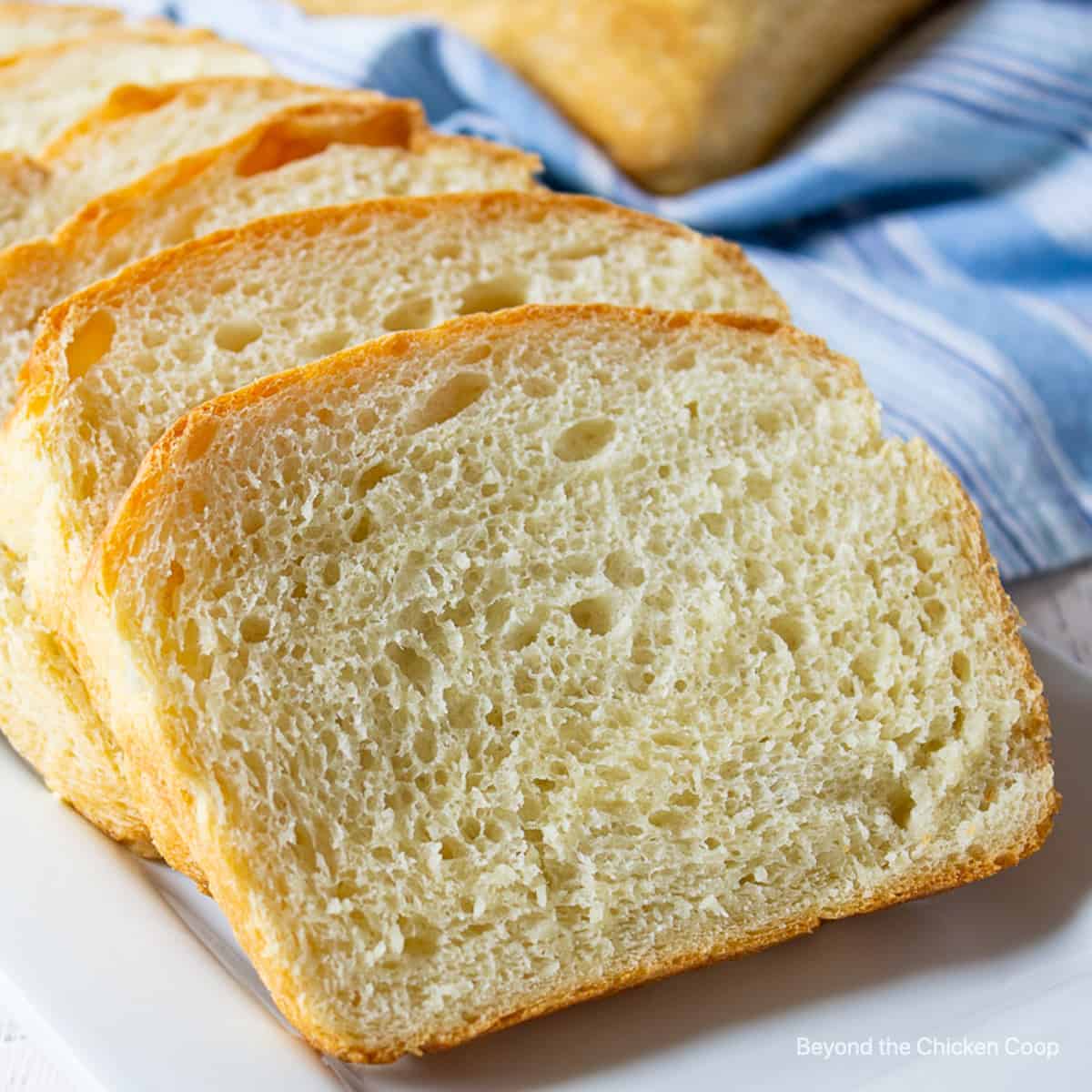 Slices of bread on a white surface.