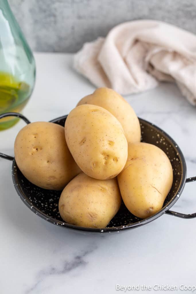 Yellow potatoes in a small bowl. 