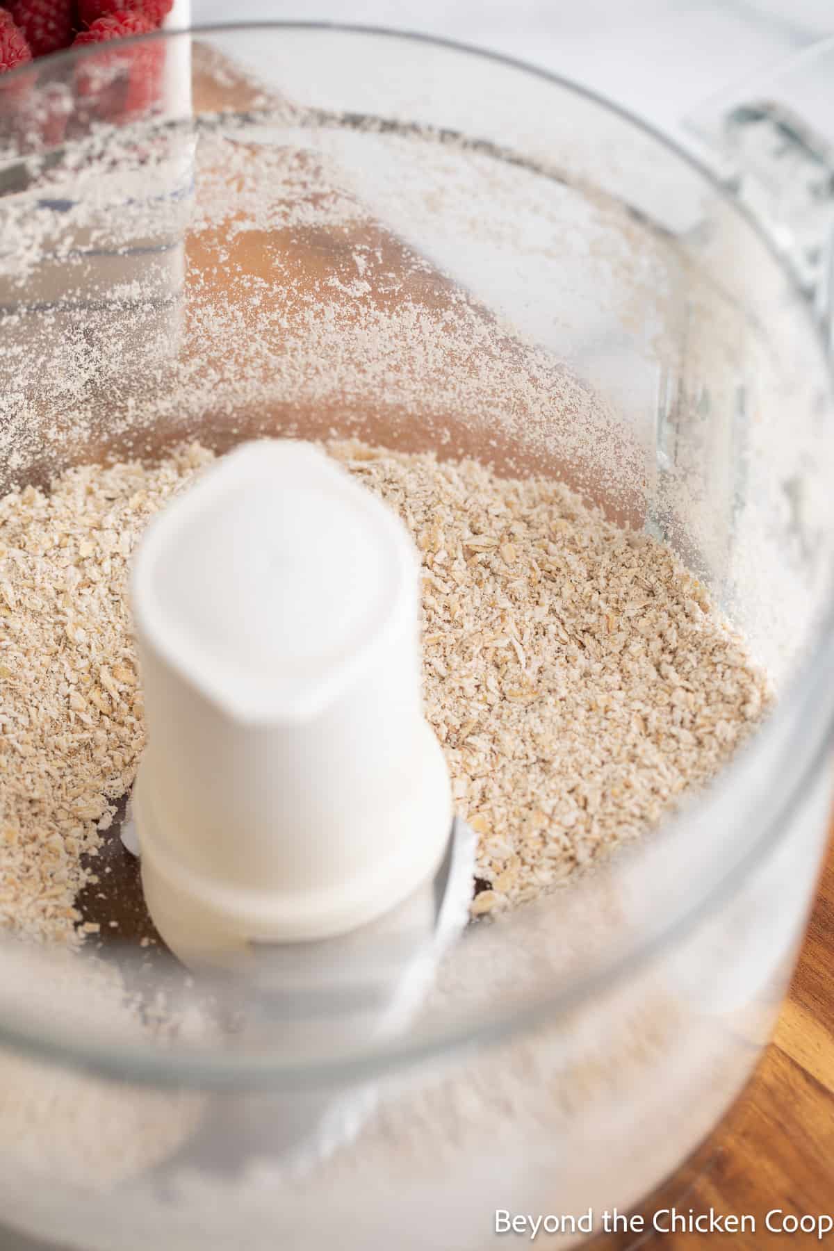 Blended oats in a food processor. 
