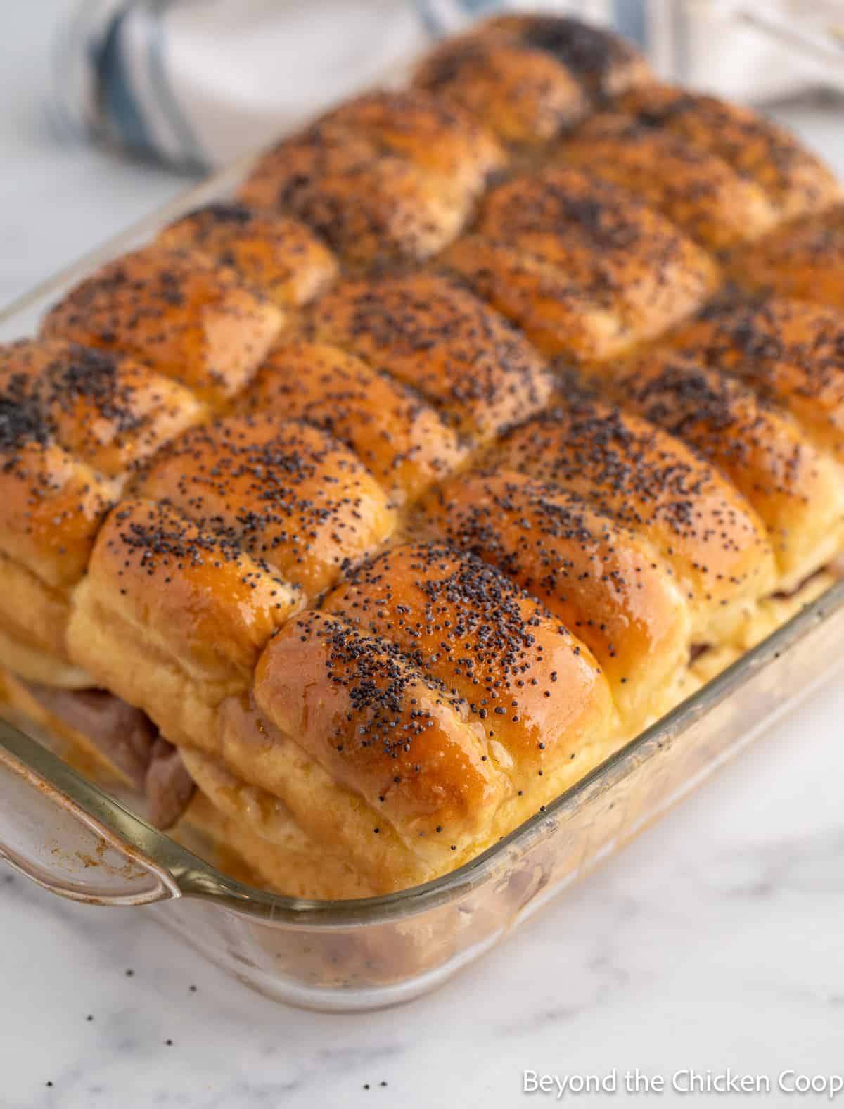 Poppy seeds on top of slider rolls. 