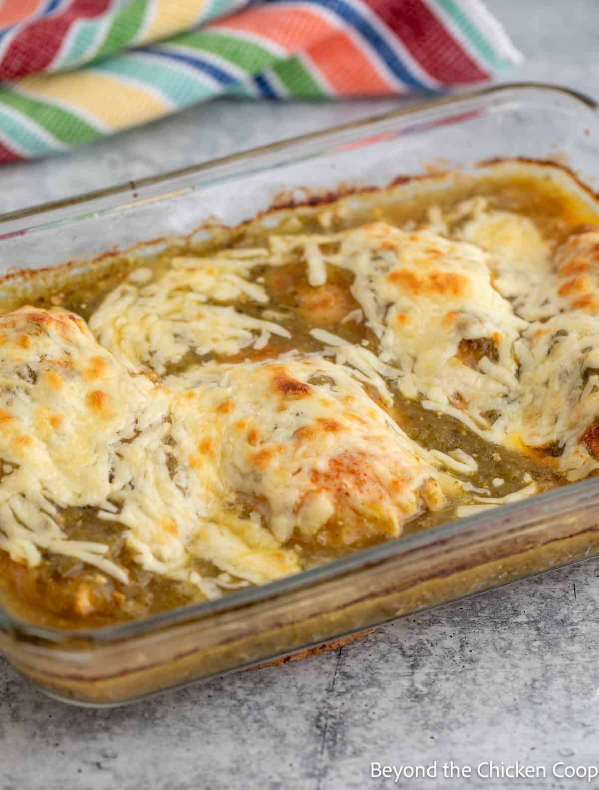 Baked chicken casserole with browned cheese. 