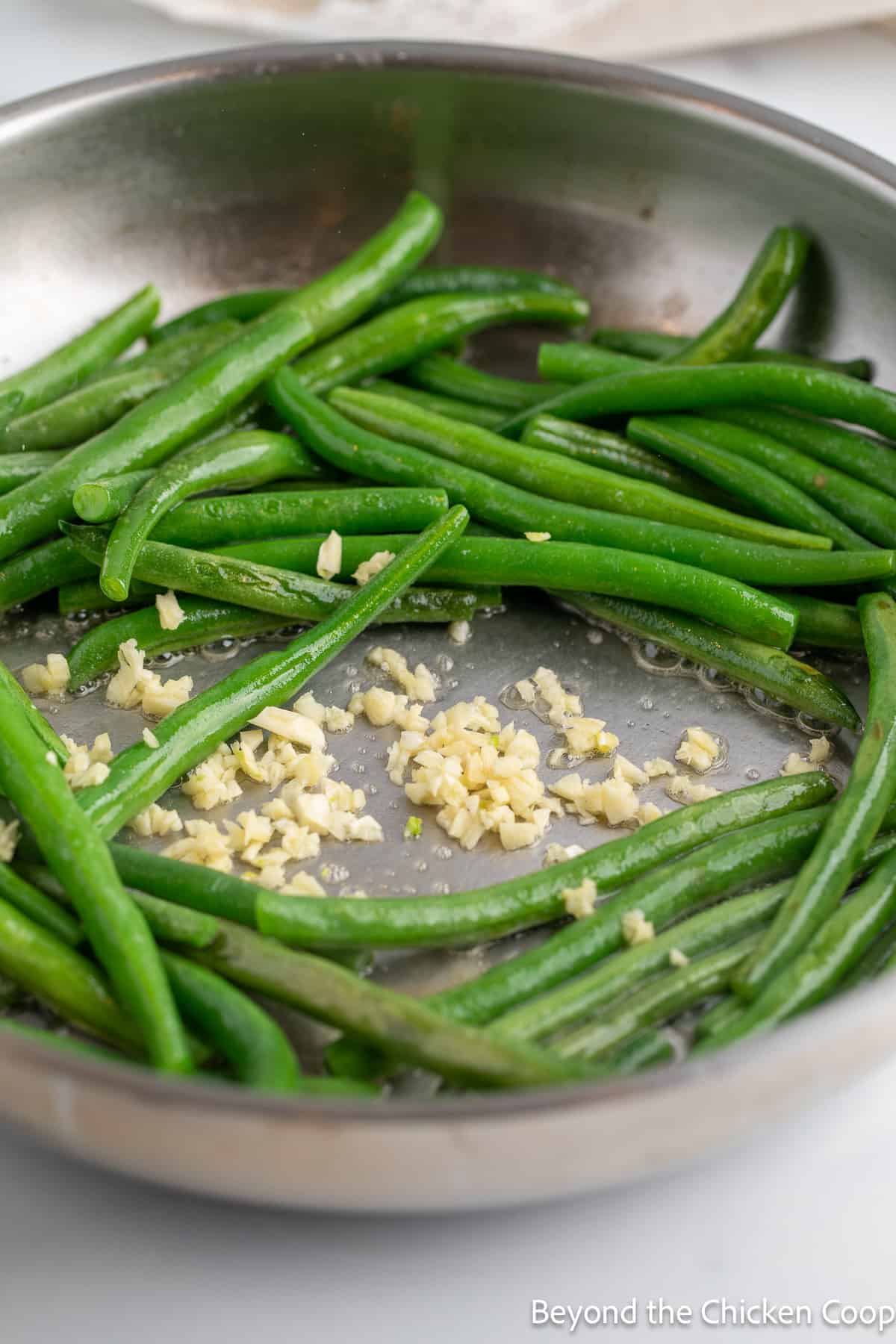 Garlic and beans in a skillet. 