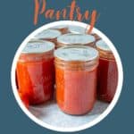 Canning jars filled with tomato sauce.