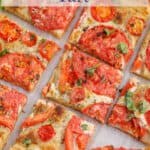 Puff pastry and tomato tart sliced into small squares.