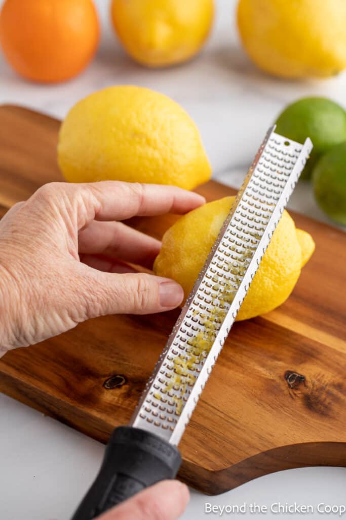 Grating a lemon rind. 