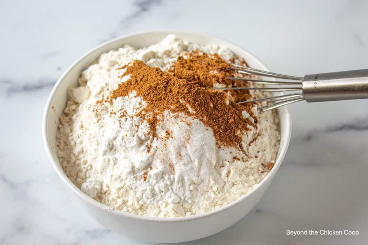 A small bowl filled with flour and spices.