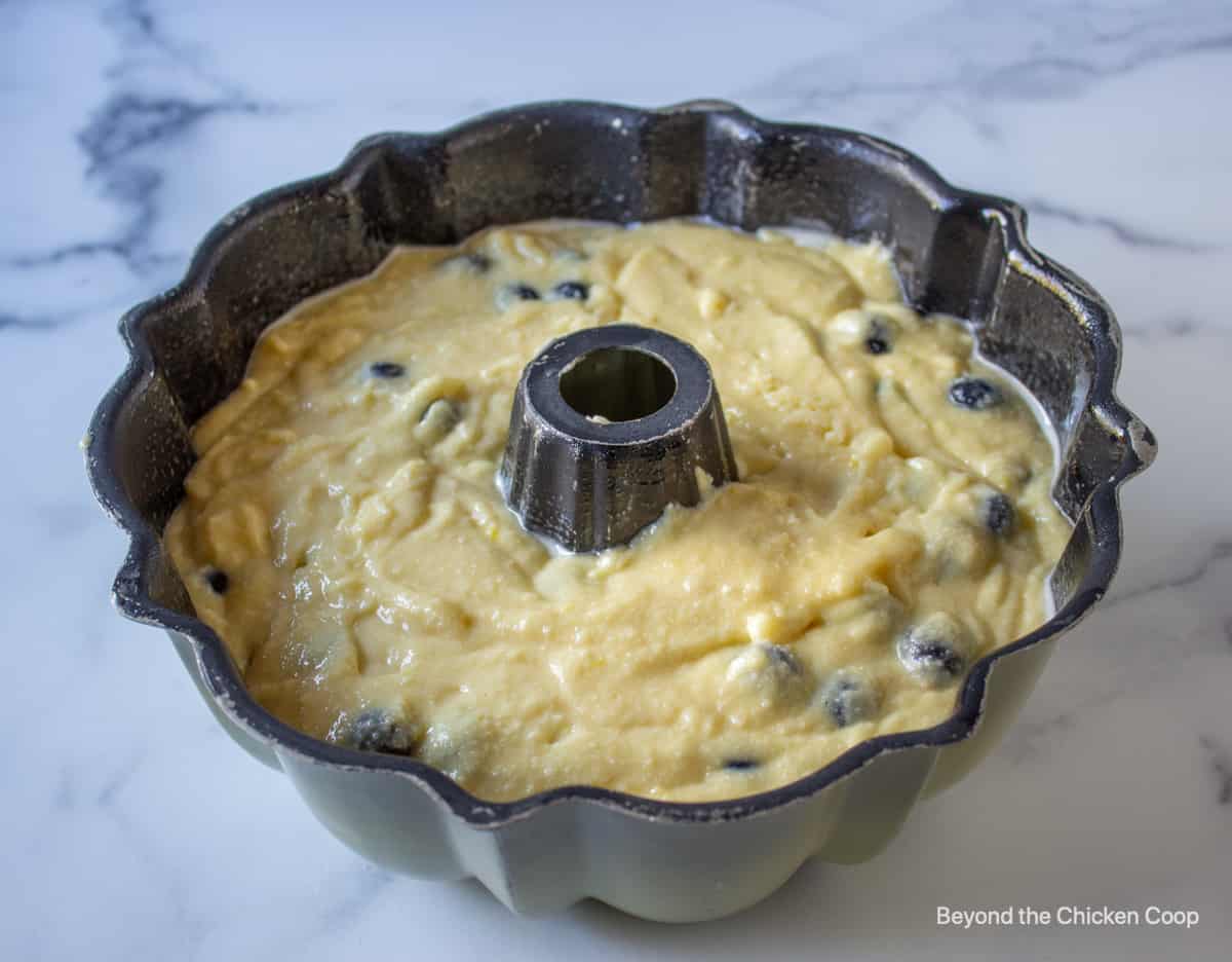 Cake batter in a bundt cake pan.