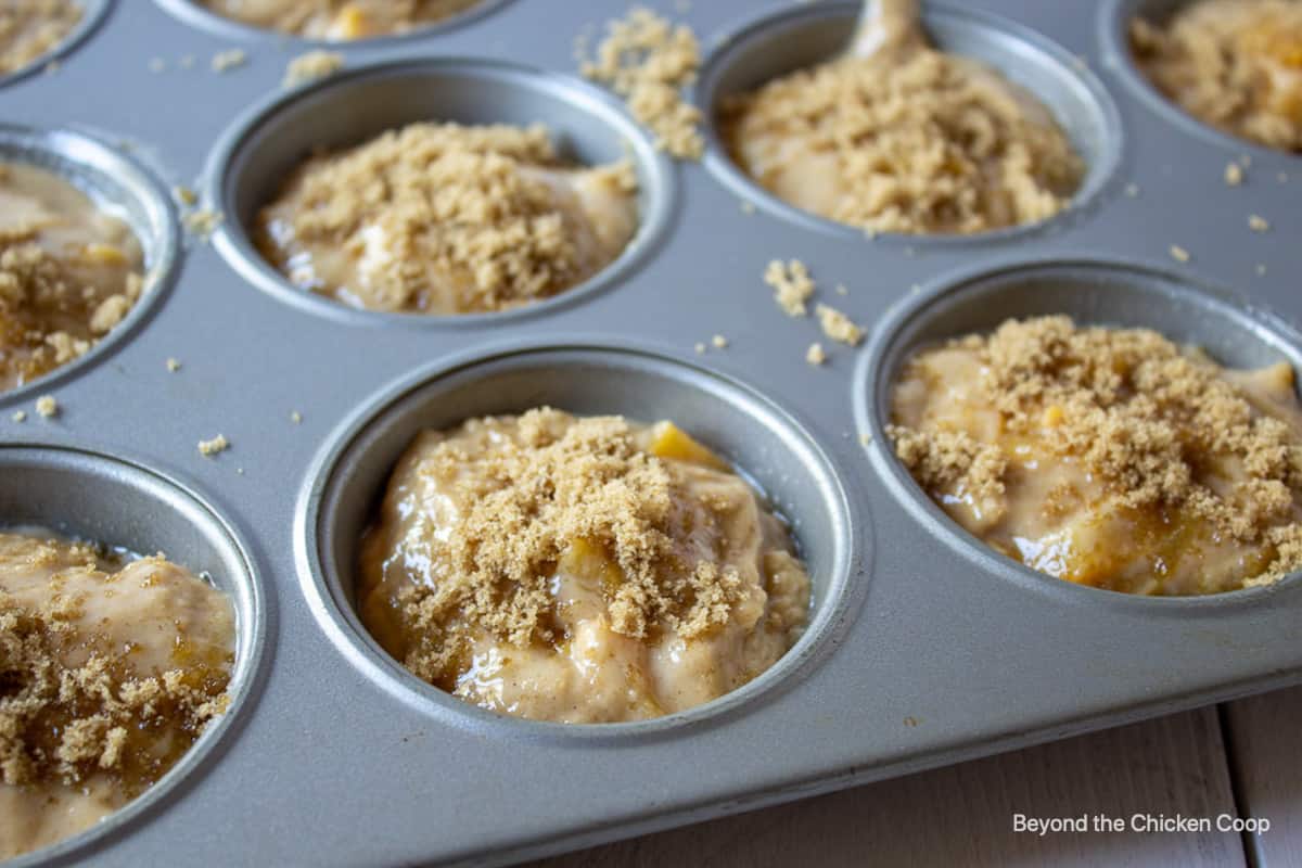 A muffin tin filled with muffin batter.