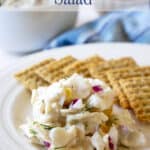 Walleye salad next to crackers on a plate.