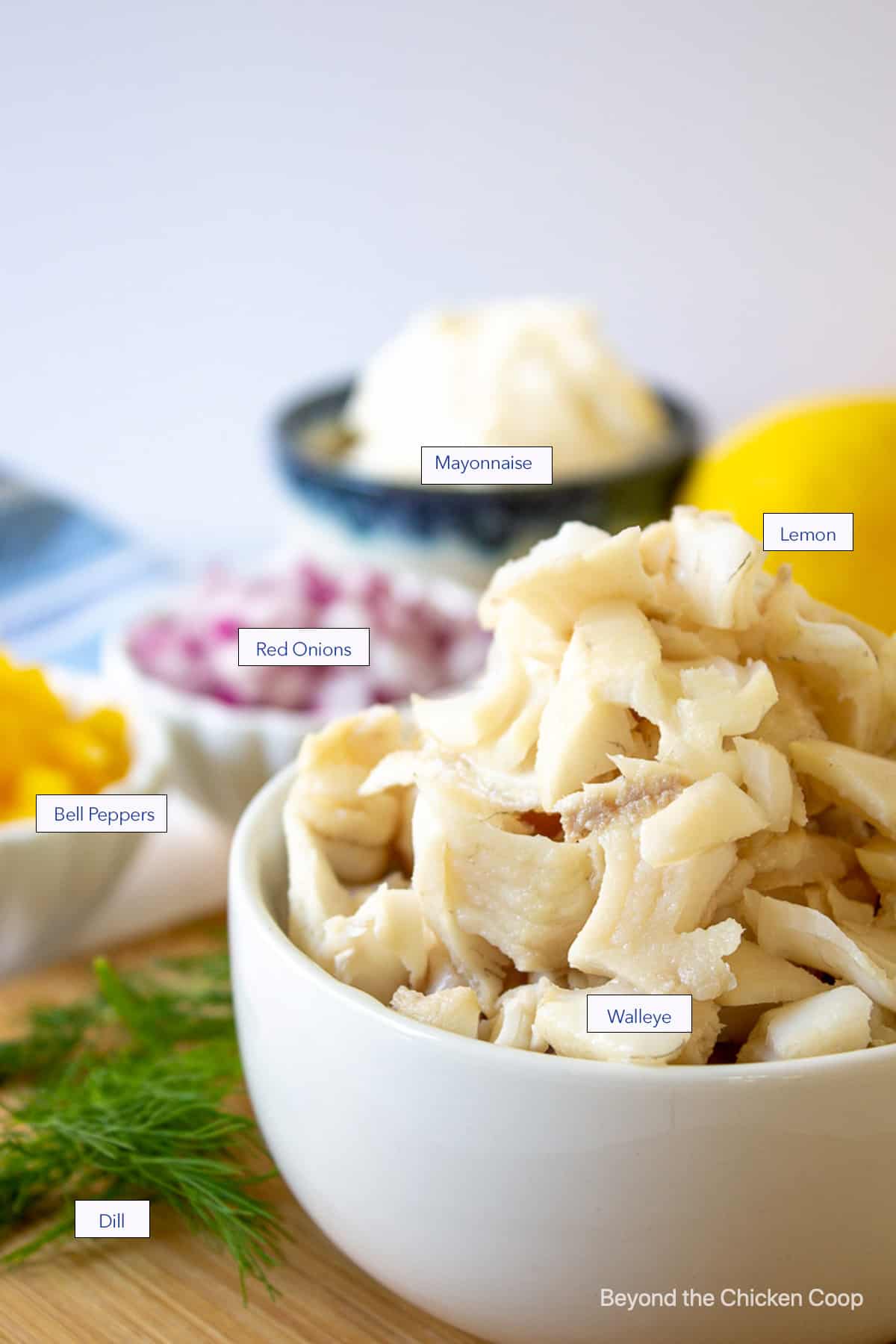 A bowl of cooked walleye along with other ingredients.