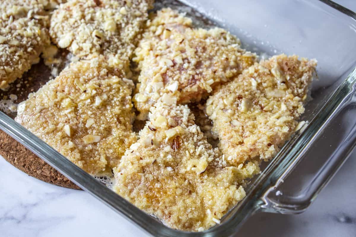 Fish fillets in a glass baking dish. 