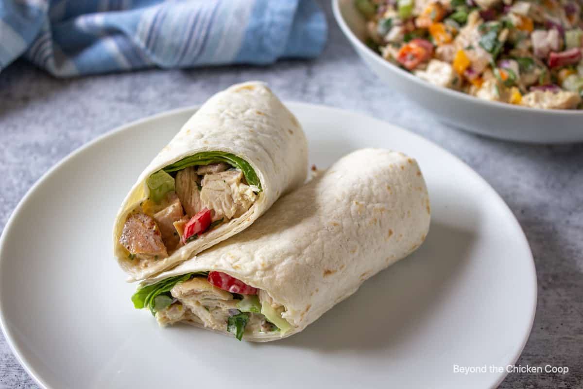 A tortilla wrapped filled with chopped chicken.