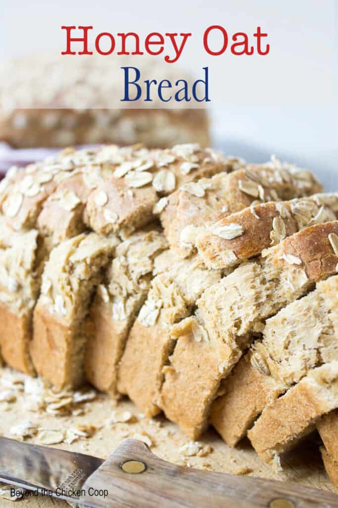A sliced loaf of bread on a cutting board.