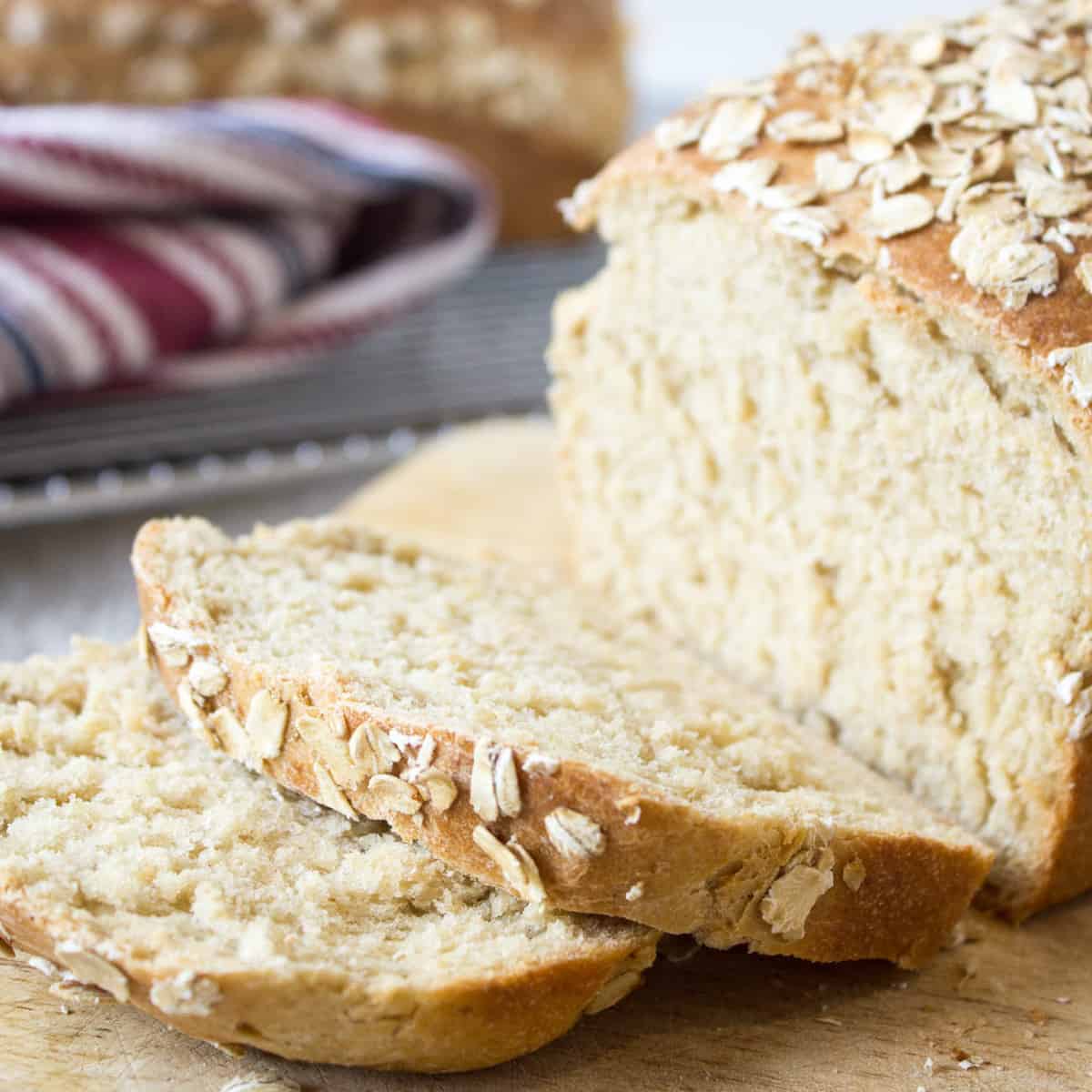 A loaf of wheat bread topped with oats.