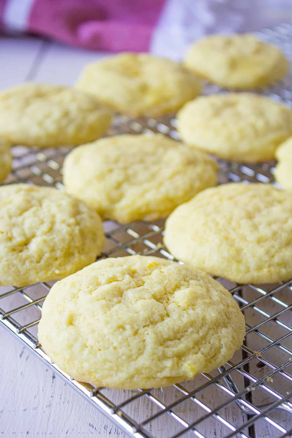 A baking rack filled with sugar cookies.