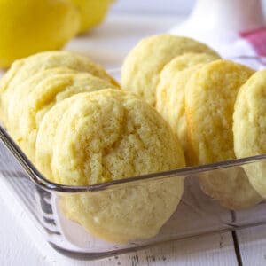 A glass container with sugar cookies.