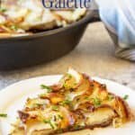 A cast iron skillet filled with crispy sliced potatoes.