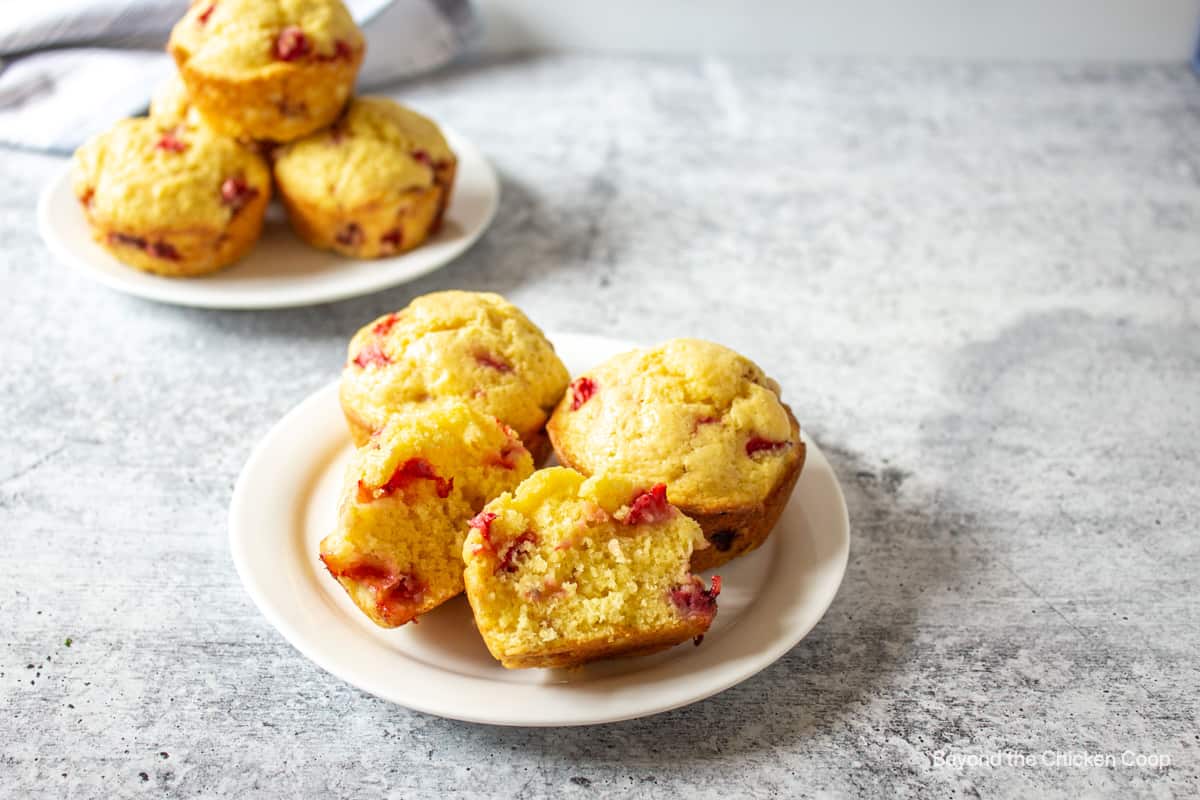 Strawberry muffins on a white plate. 