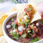 A bowl filled with salsa.