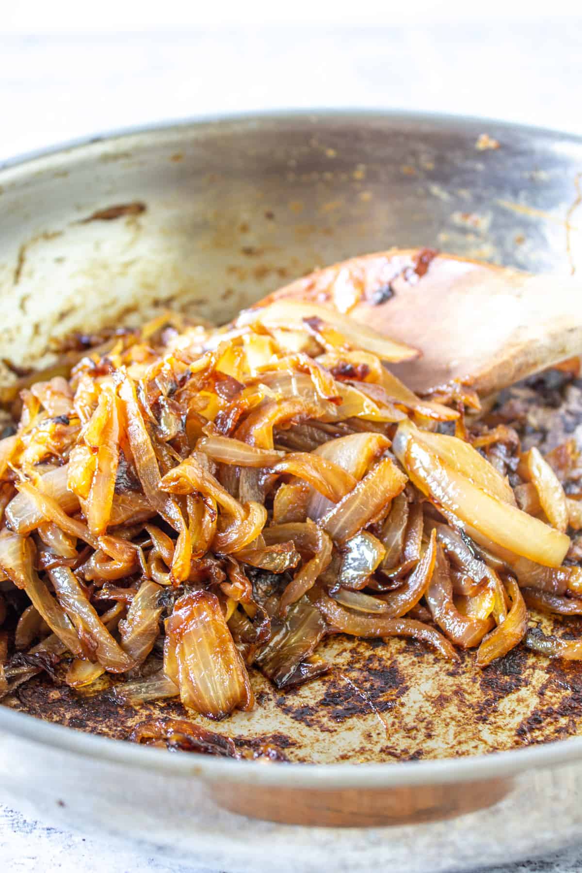 Browned onions in a frying pan.