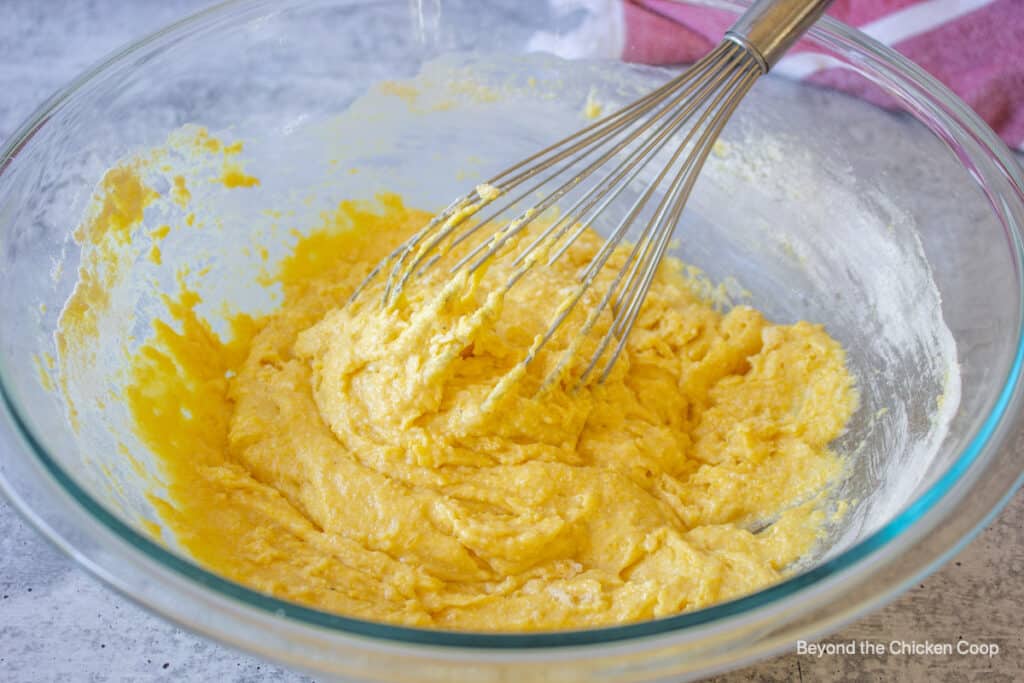 Muffin batter in a glass bowl.