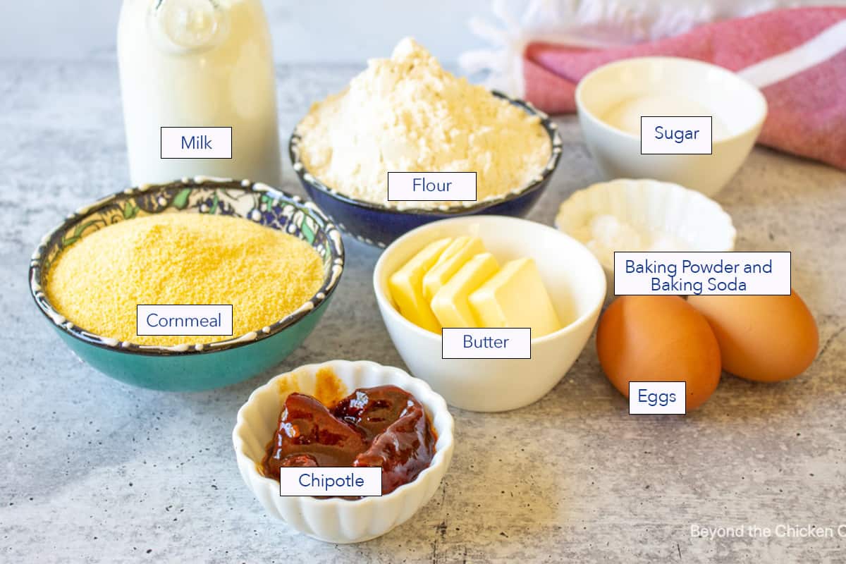 Small bowls filled with ingredients for making muffins.