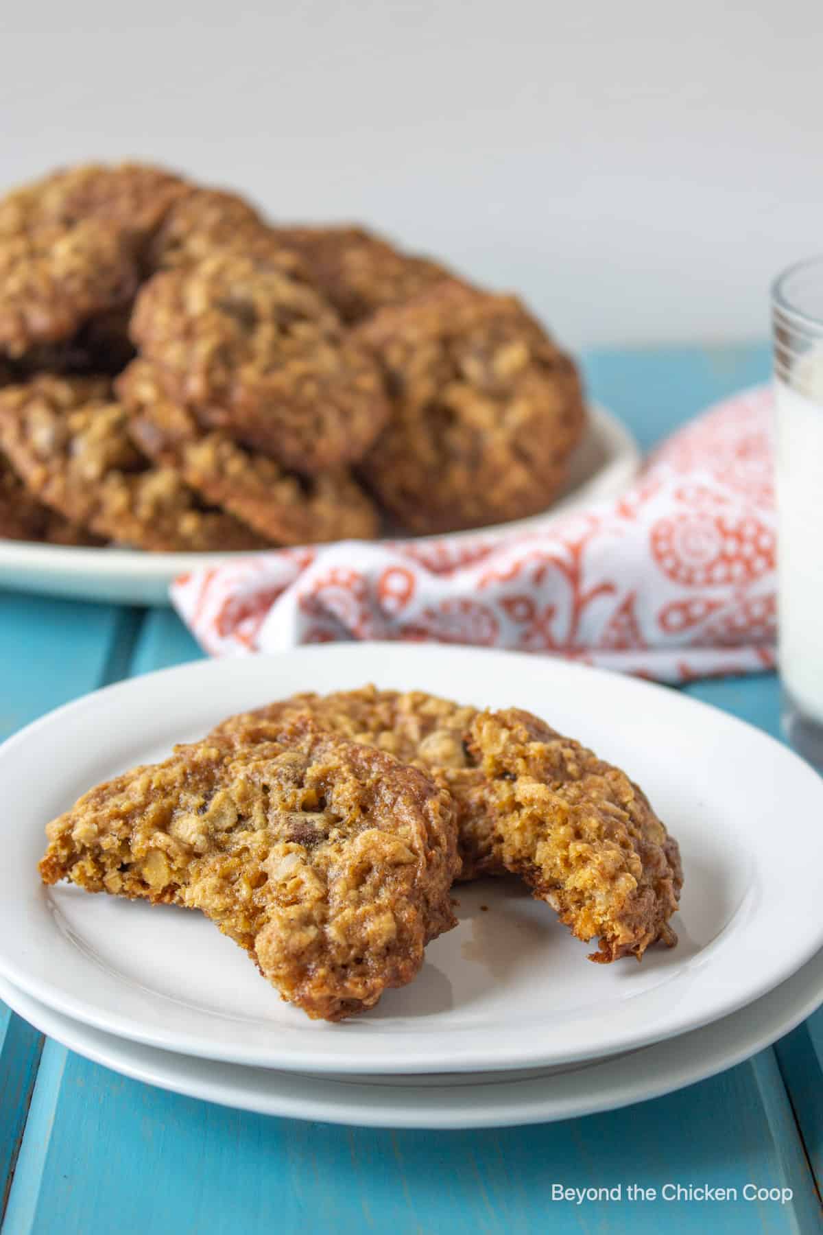 Oatmeal chocolate chip cookies on a white plate.