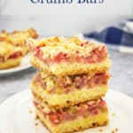 Three rhubarb bars stacked on top of each other.