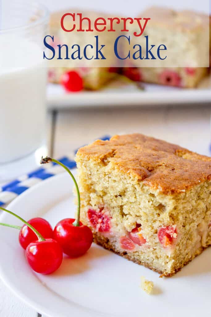 A slice of cake filled with cherries on a plate.