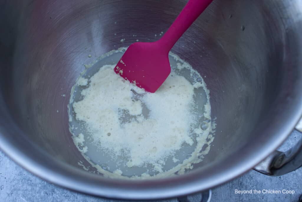 Active yeast that is bubbly in a bowl.