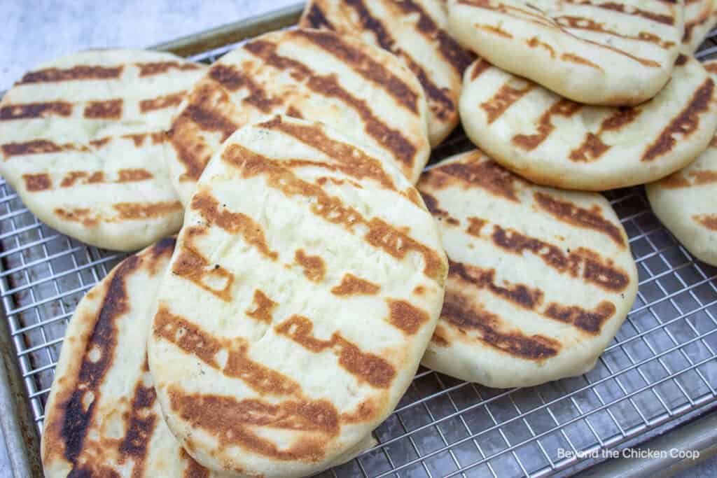 Cooked flatbread on a baking rack.