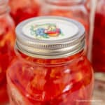 A jar of home canned tomatoes.