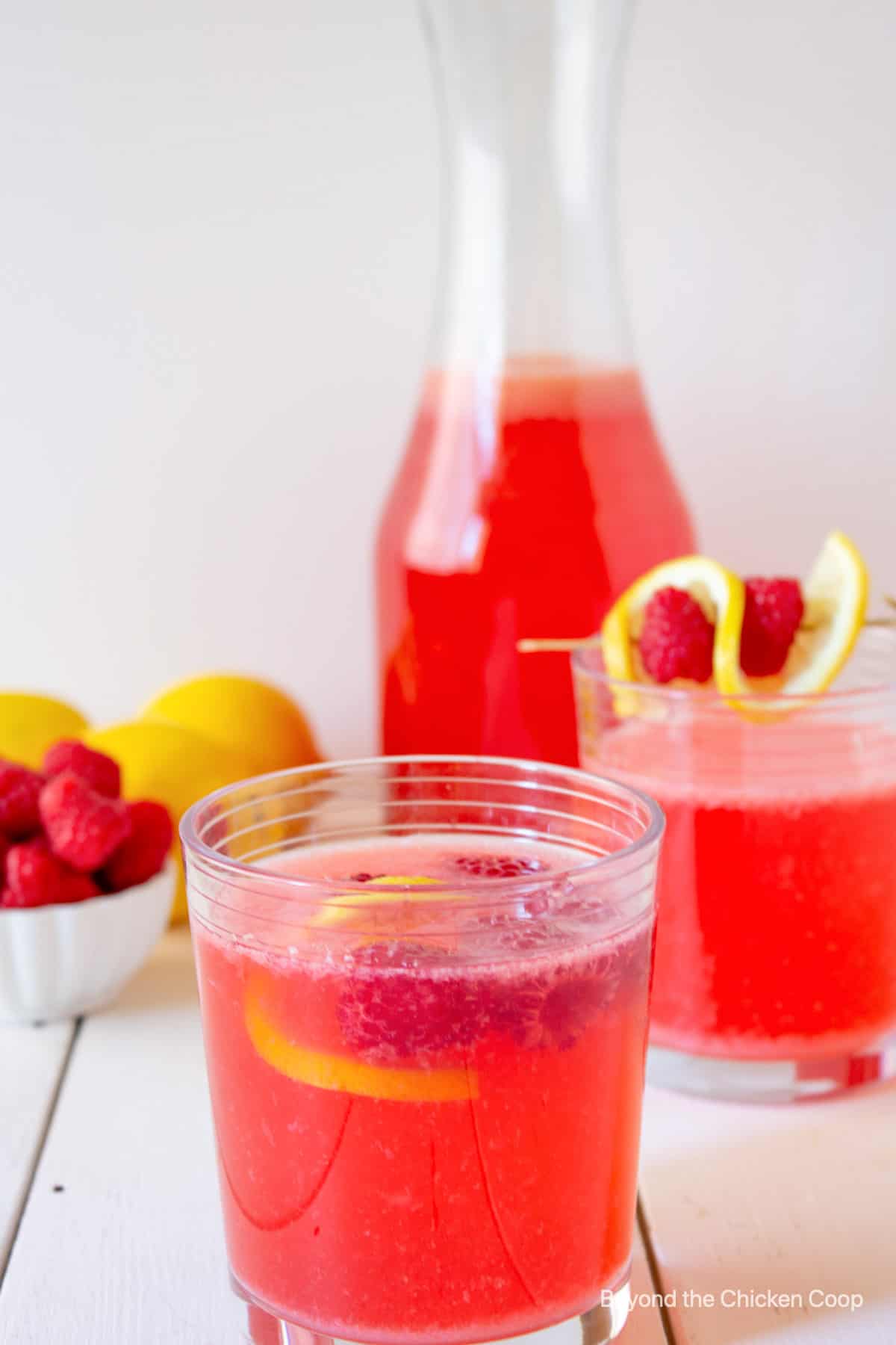 Two glasses of raspberry lemonade.