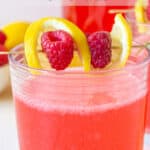 A glass filled with pink lemonade.
