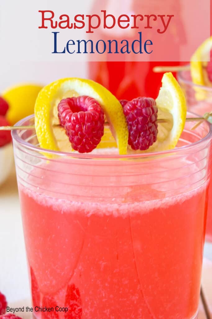A glass filled with pink lemonade.