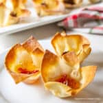 Wonton cups filled with cheese and pepper jelly.