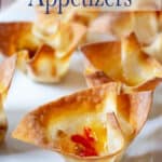 Small wonton cups filled with cheese and pepper jelly.