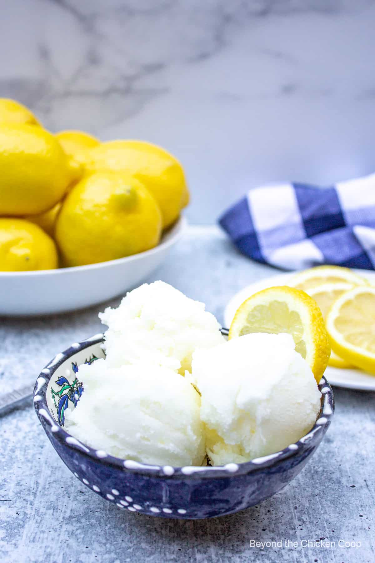 Scoops of sorbet in a blue bowl.