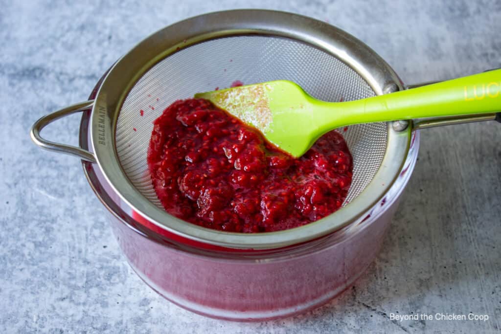 Raspberries in a sieve.