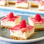 Stacked cheesecake bars with a raspberry swirl.