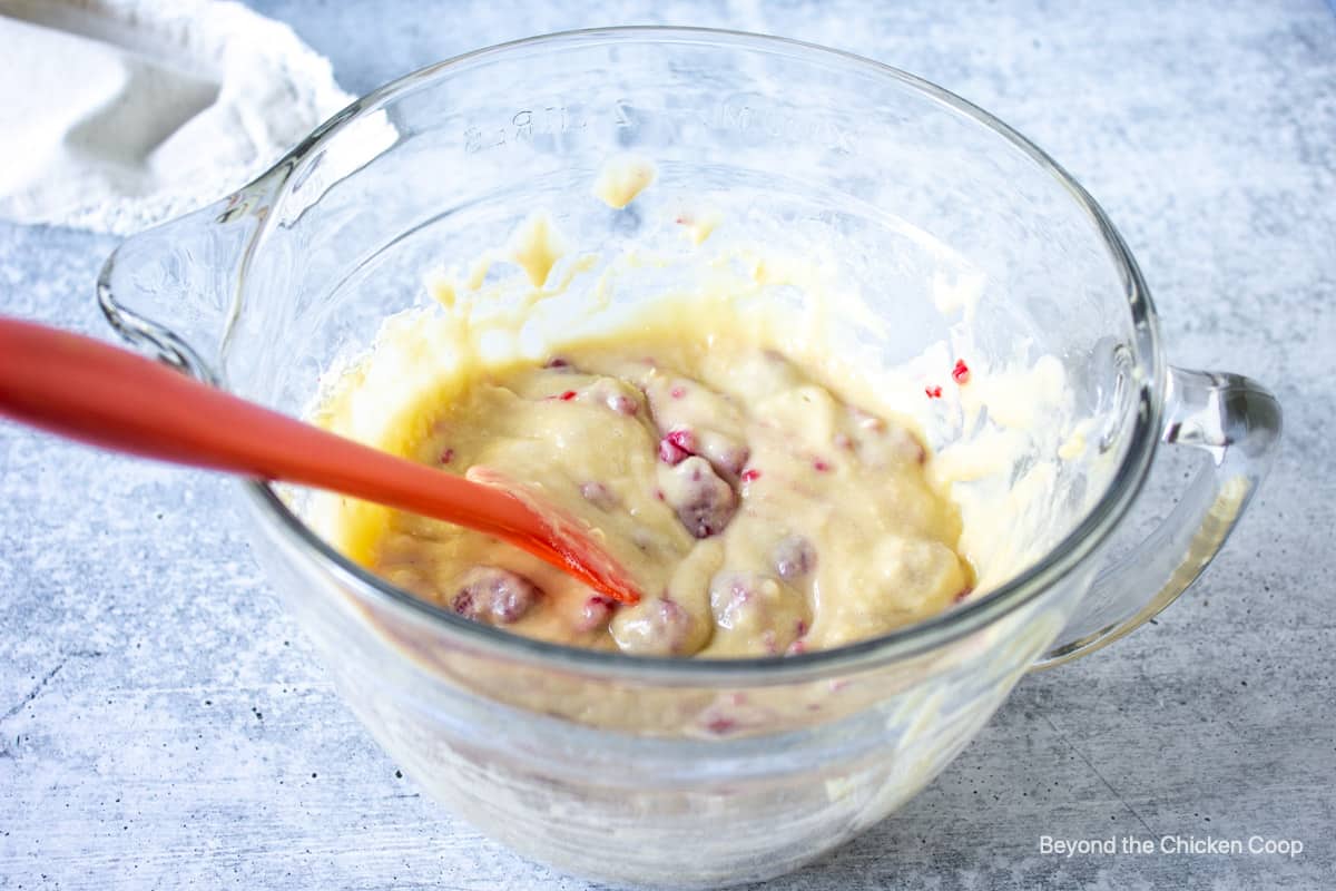 Donut batter with raspberries.