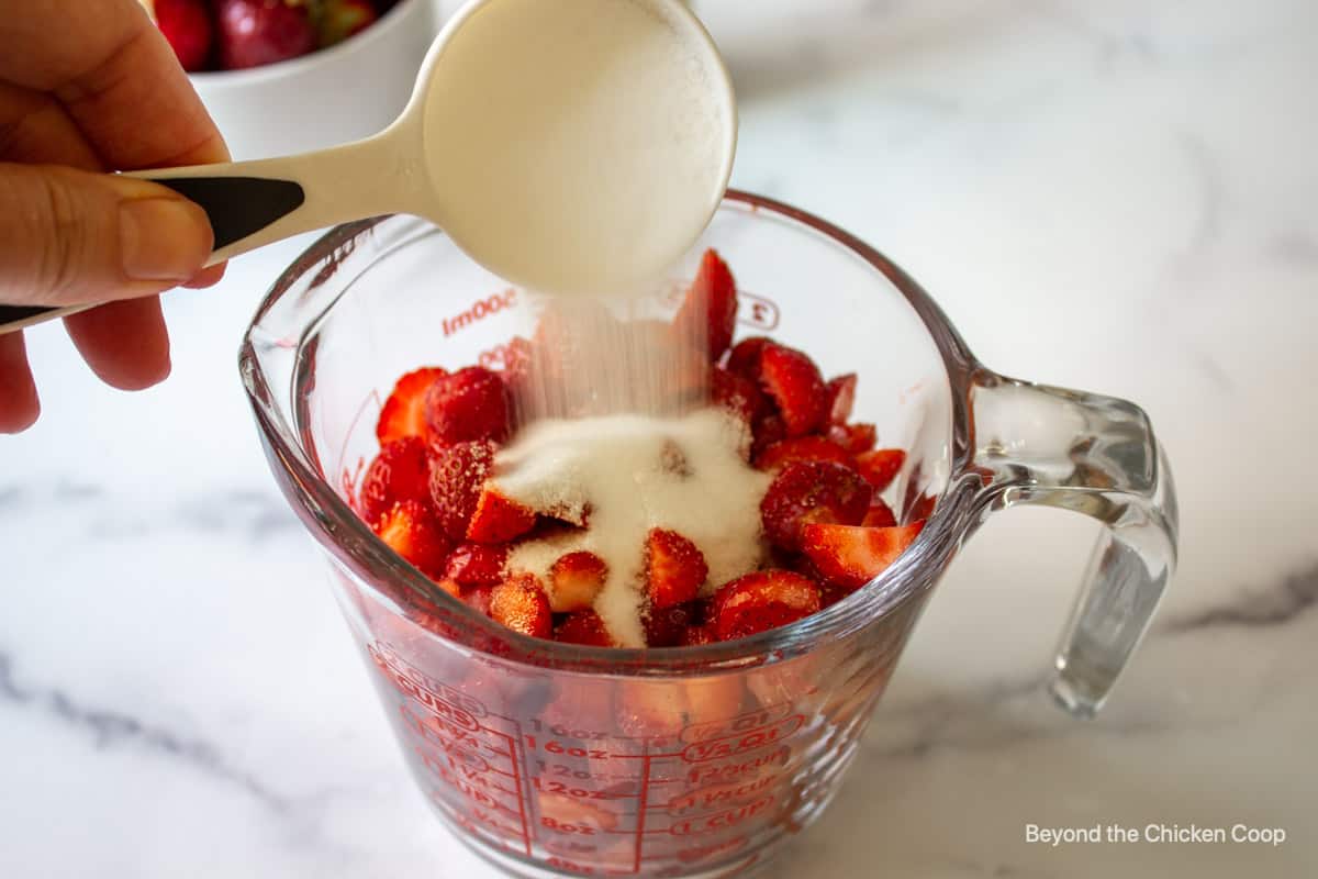 Cut up strawberries with sugar poured over the top.