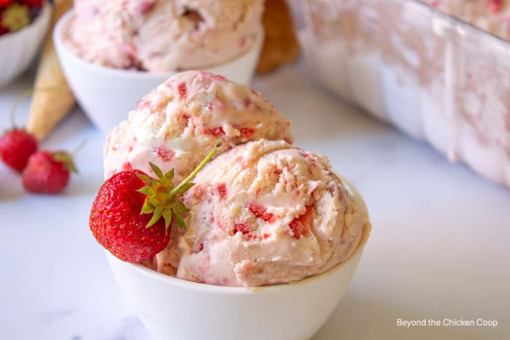 Scoops of ice cream with strawberries.