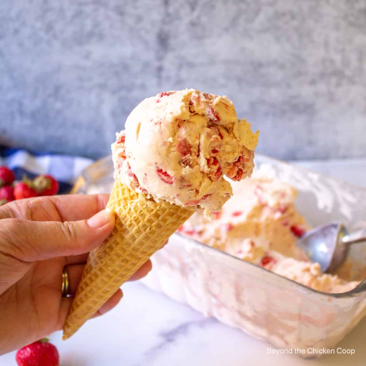 A scoop of ice cream on an ice cream cone.