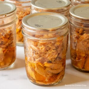 A canning jar filled with smoked fish.