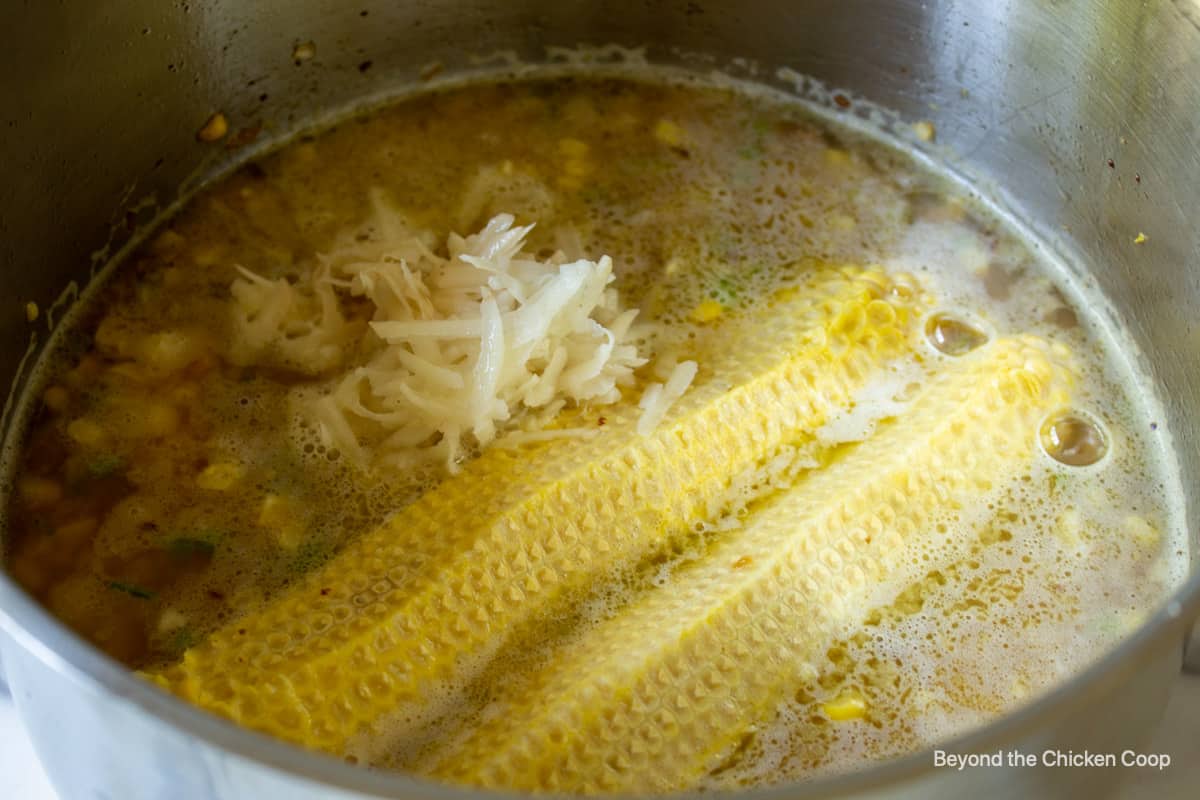 Grated potatoes in a stock pot.