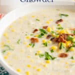 A bowl of chowder with corn, bacon and fresh parsley.