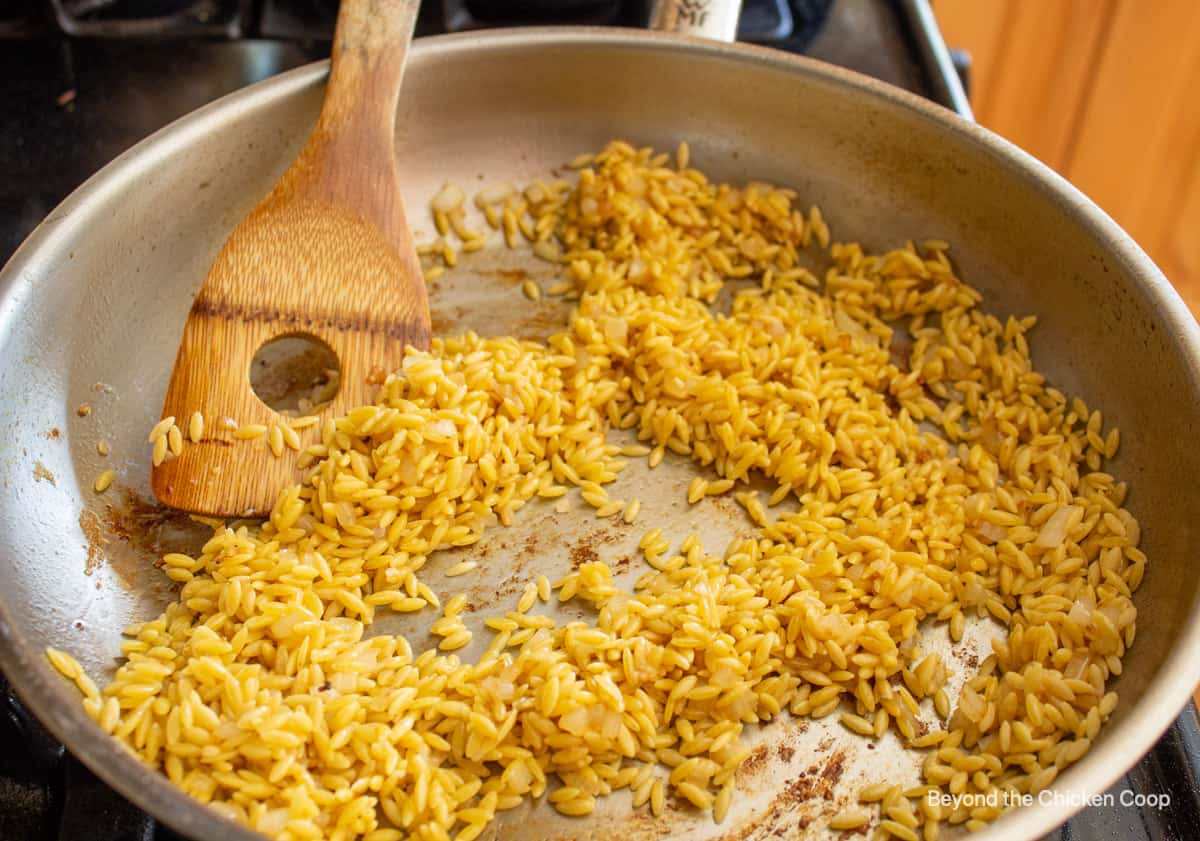 Orzo pasta in a pan.