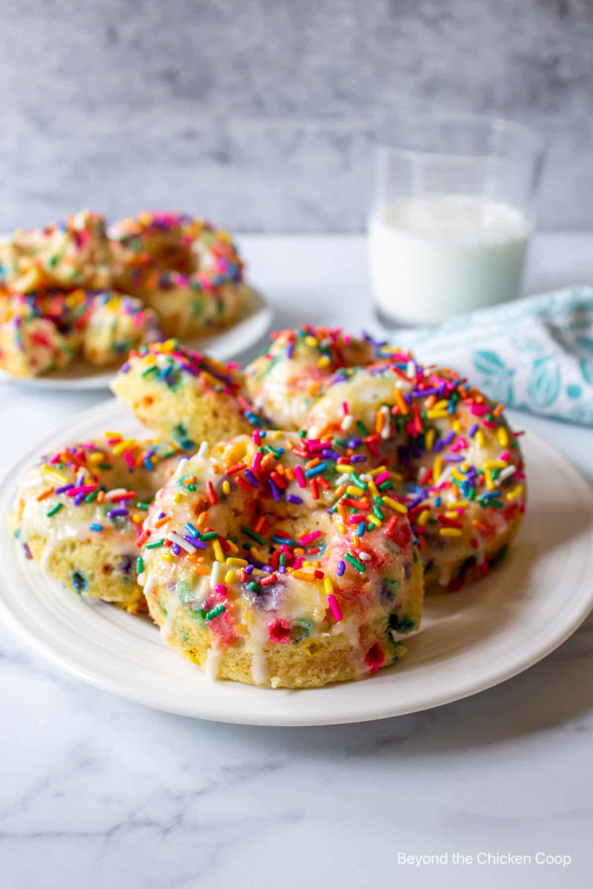 Colorful donuts on a plate.